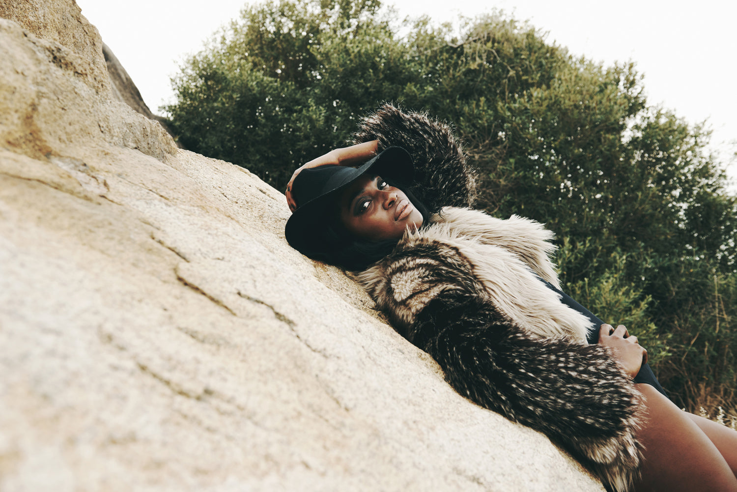 Woman on a beach mountain boho style wearing fur and bathing suit_VERGE Lifestyle Magazine Boho Chic Digital Issue