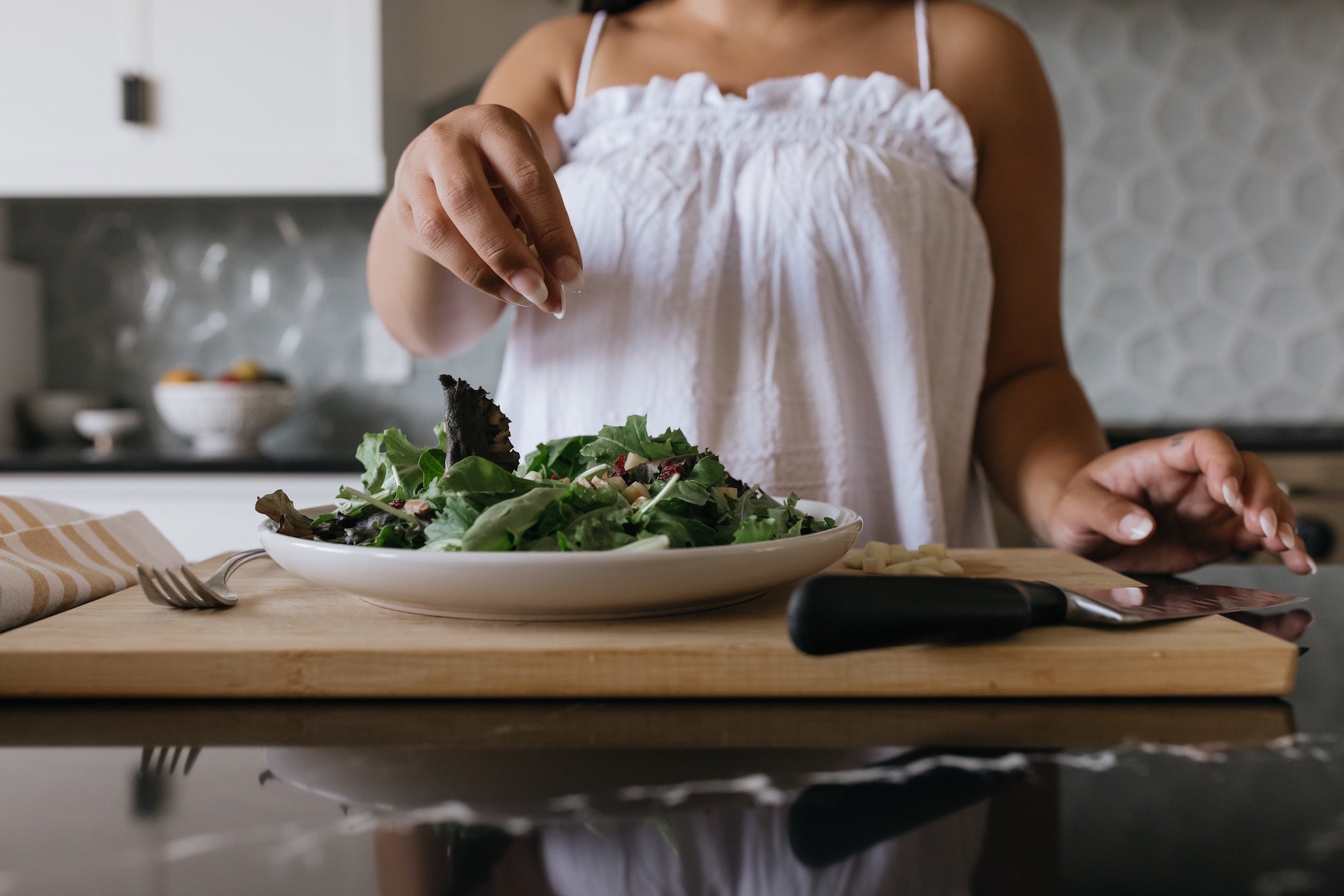 Woman making plant-based salad recipe_VERGE Lifestyle Magazine Online